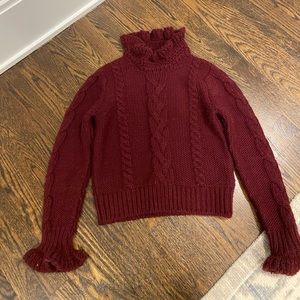 See by Chloe burgundy’s will cropped sweater with ruffle neck.